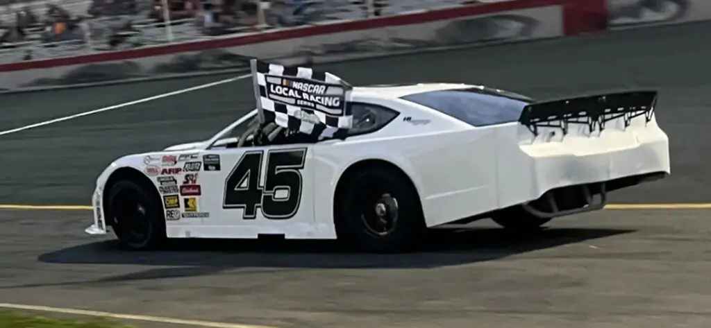 Winning race car on asphalt track