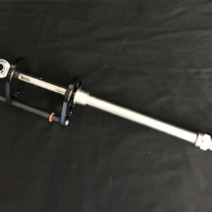 A bicycle pump on the ground with black background