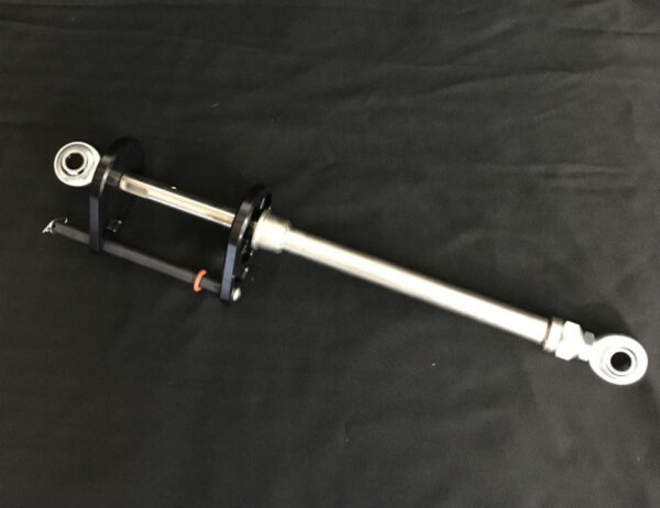 A bicycle pump on the ground with black background