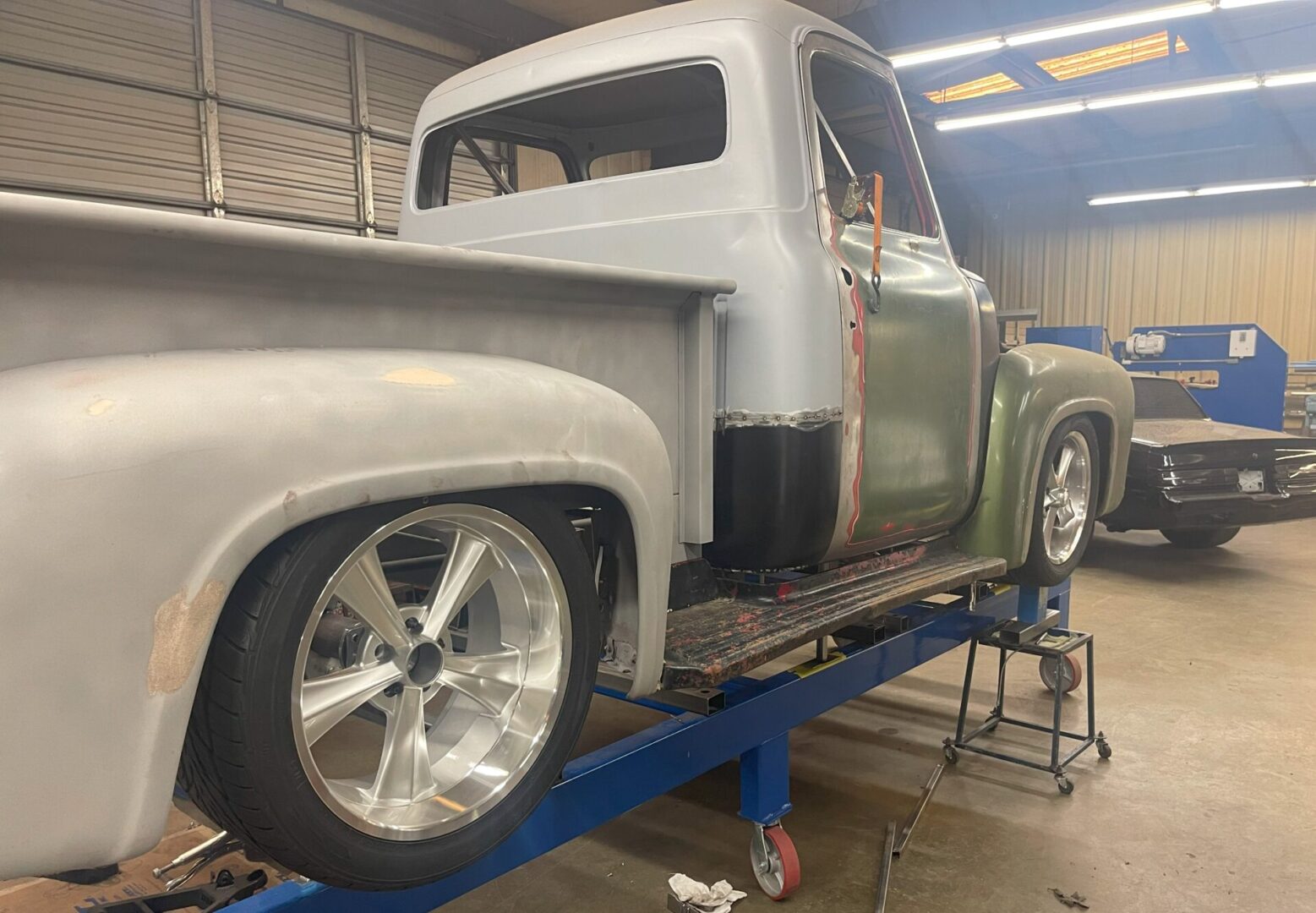 A truck is being worked on in the shop.