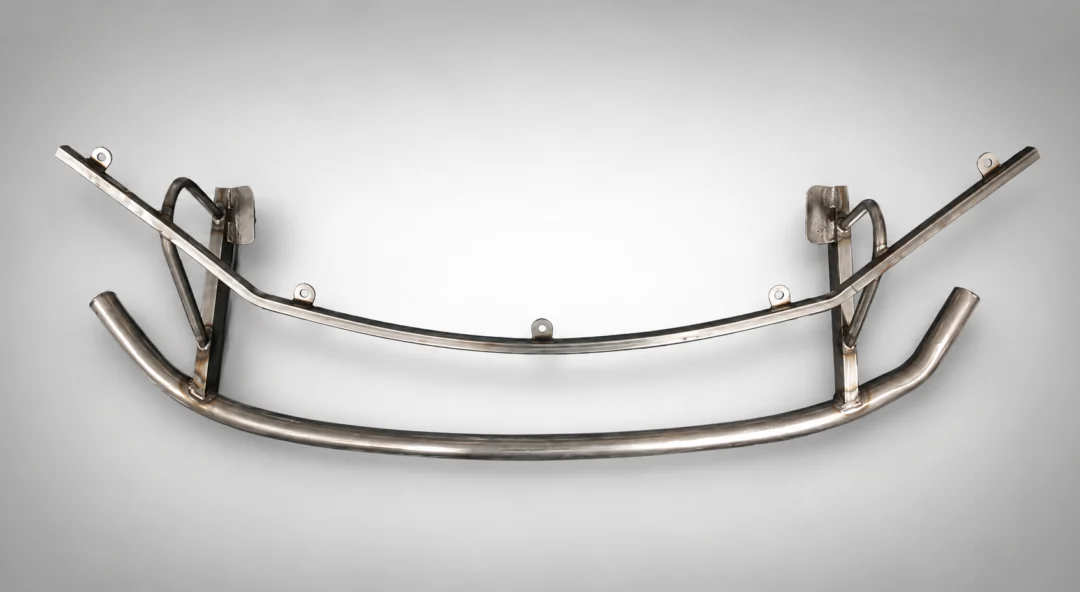 Close up of a stainless steel grab bar on a white background