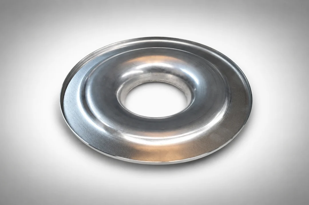 Metal plate with a hole in the middle on a white background