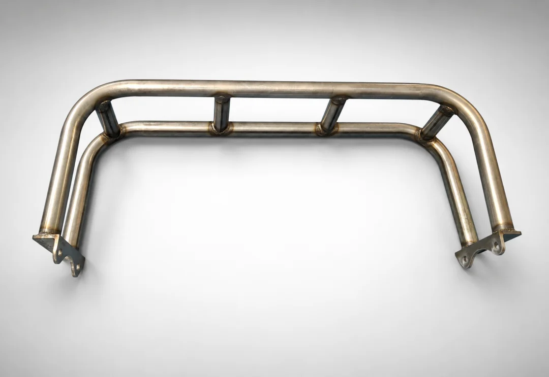 Close up of a stainless steel roll bar on a white background