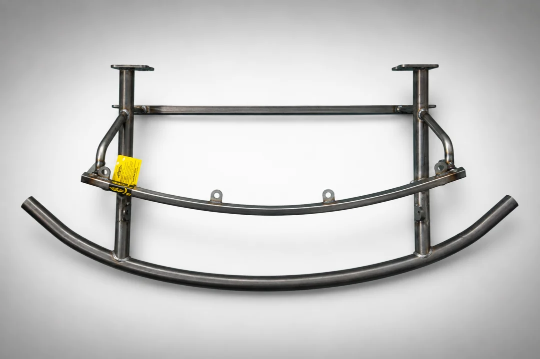 Close up of a metal frame on a white background with a yellow tag attached to it