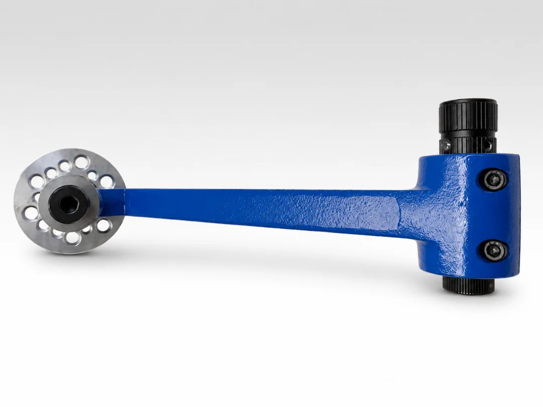 Close up of a blue metal object, a torque converter, on a white background