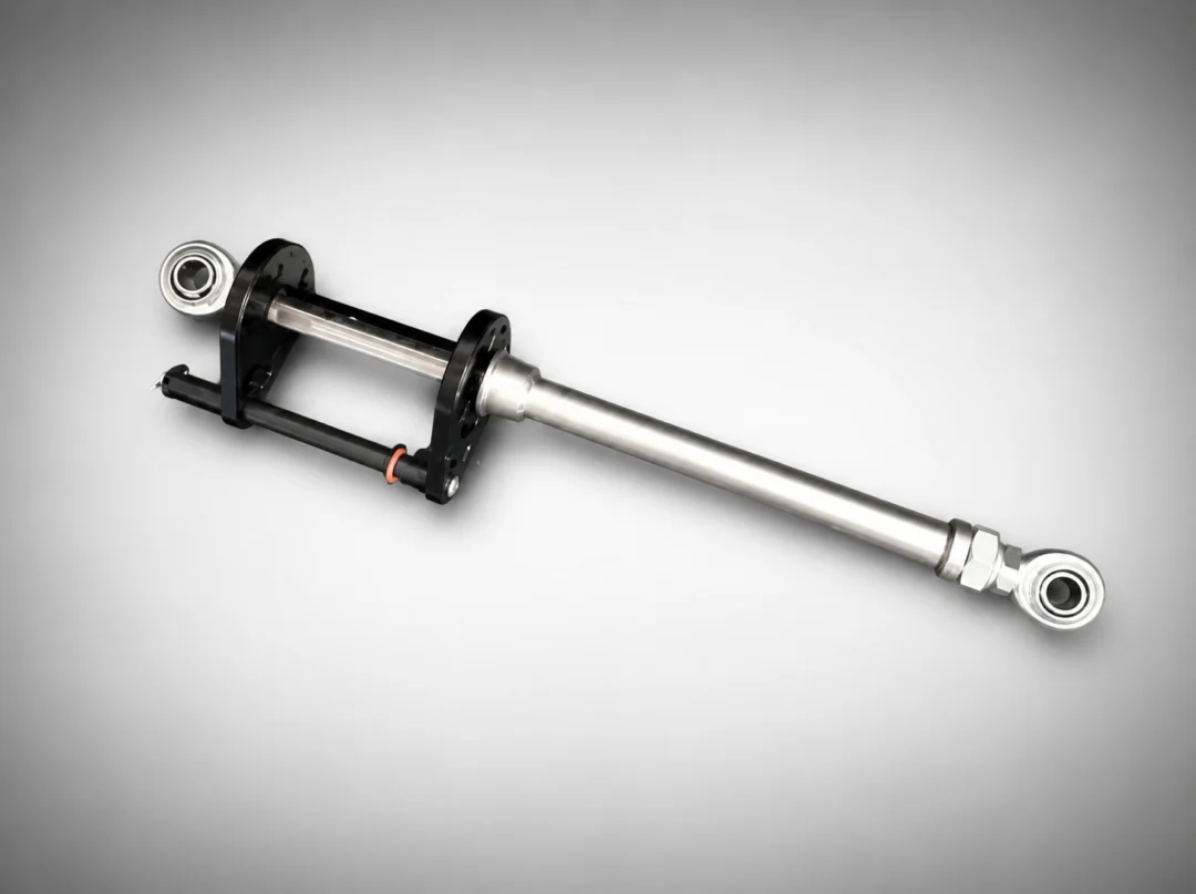 Close up of a metal shock absorber on a gray background